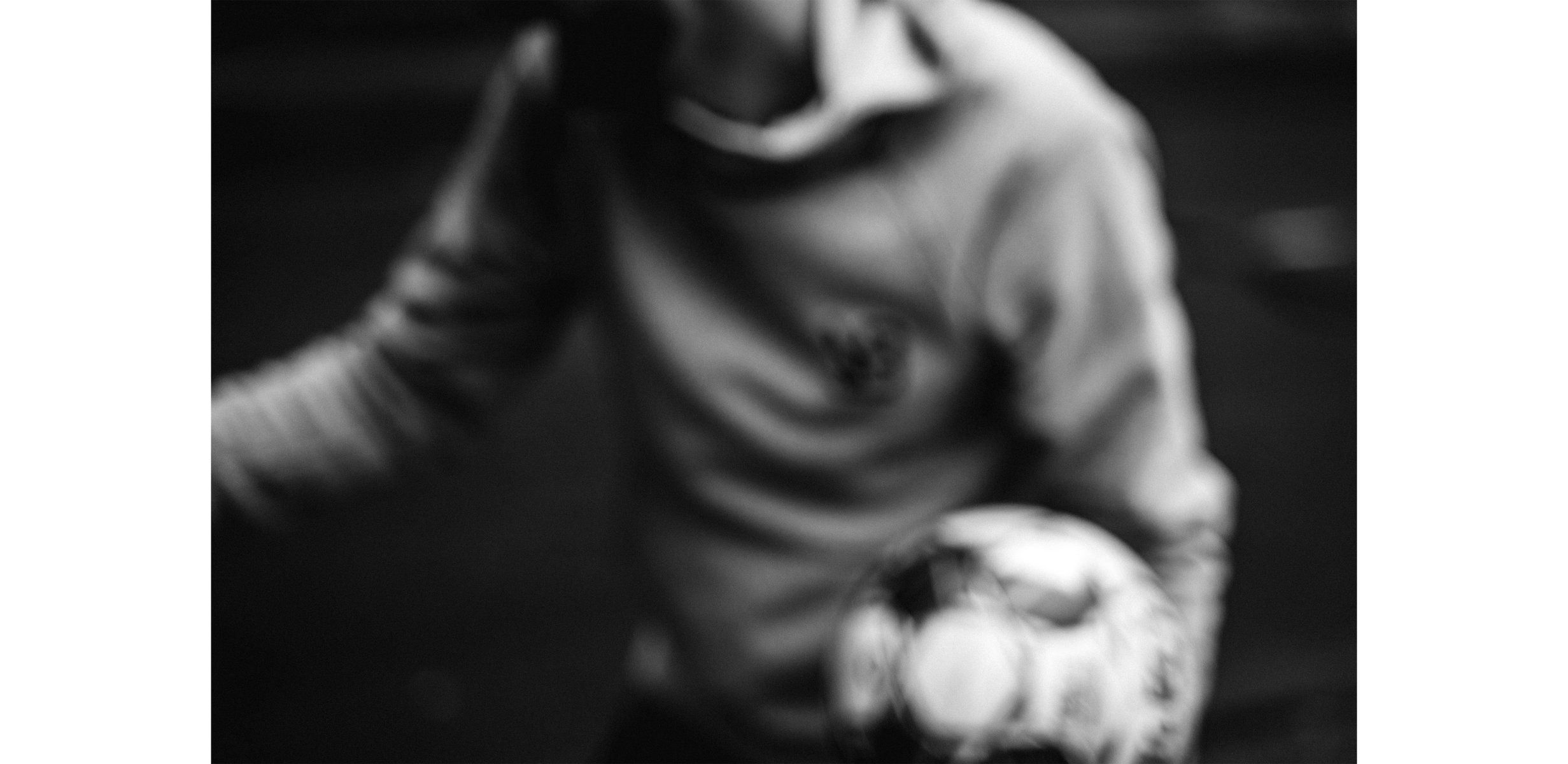  Lyvecap
A blurred image of a soccer player wearing a grey sweatshirt, in motion and tossing a soccer ball from hand to hand. by Sydney SG