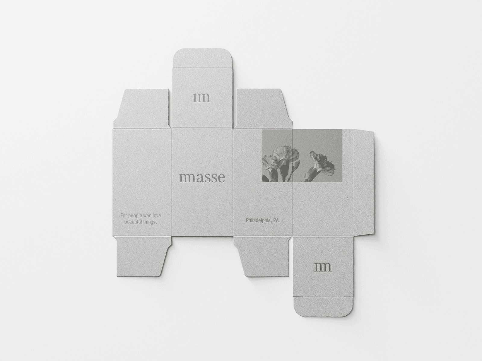 A flat packaging template for "masse" brand showing the unfolded box design with floral imagery. The gray cardboard template includes text "For people who love beautiful things" and "Philadelphia, PA" with botanical illustrations. by Sydney SG