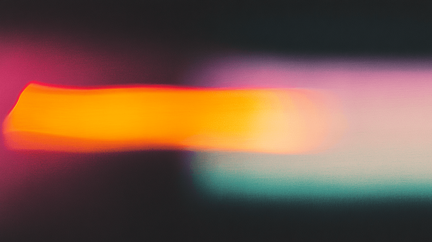 Abstract blur featuring vibrant colors ranging from bright orange and pink to deep purple and teal. The heavily blurred composition creates flowing bands of saturated color across the frame. (AI-generated image) by Sydney SG