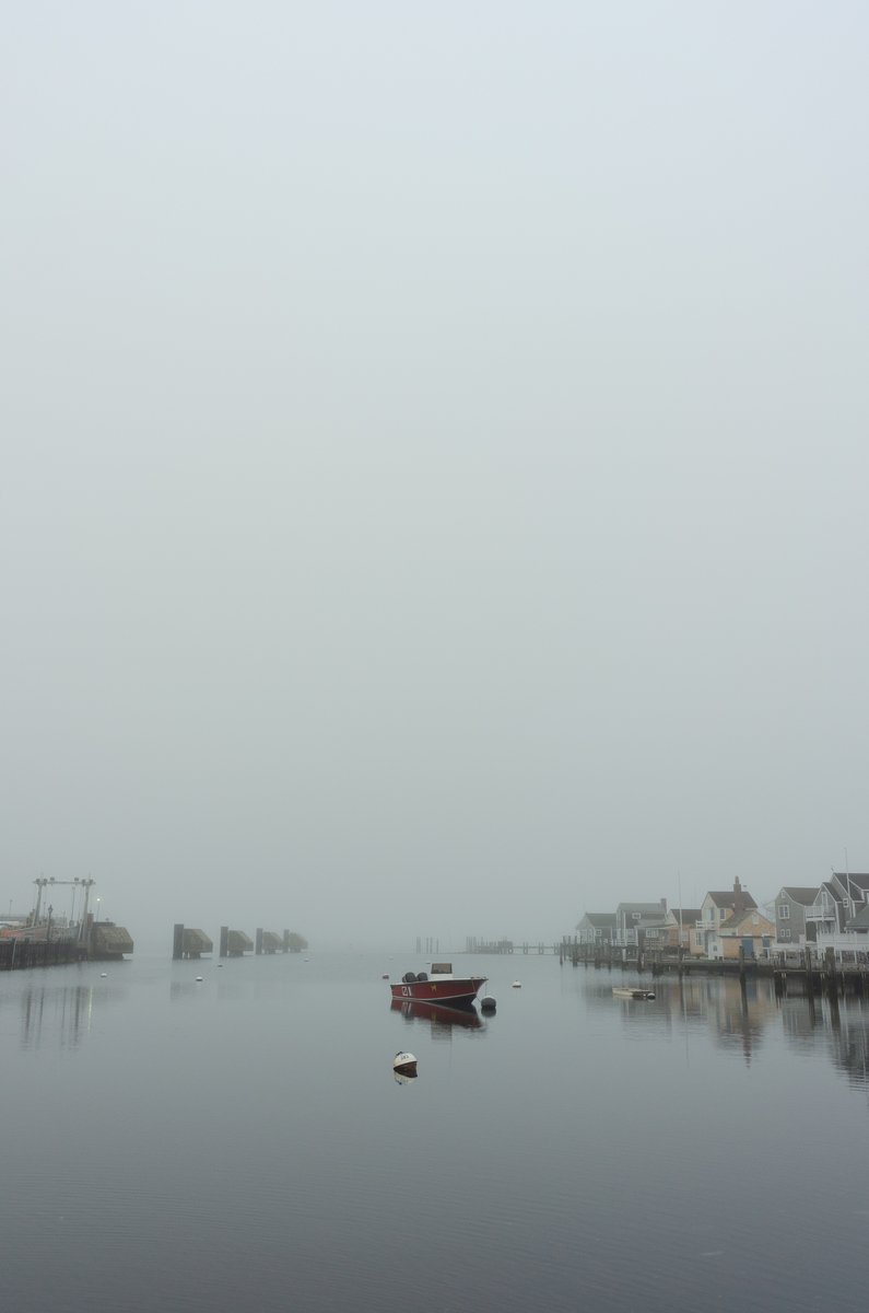  Personal Work
A single boat floating on calm, hazy water in a port in Nantucket. by Sydney SG